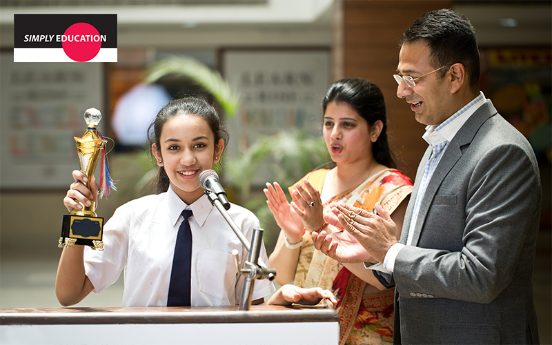 parents celebrating academic milestones with child