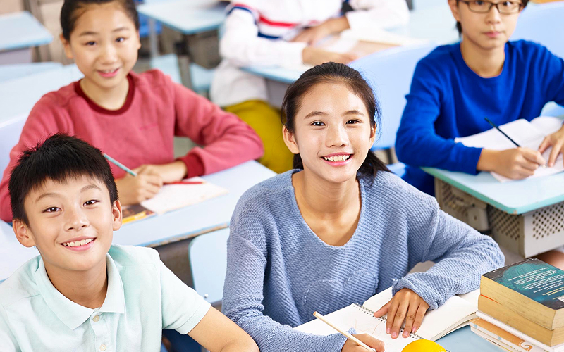 Students participating in class discussions at a tuition center.